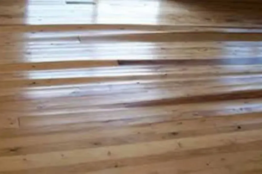 Hardwood floor boards cupping after water got under them